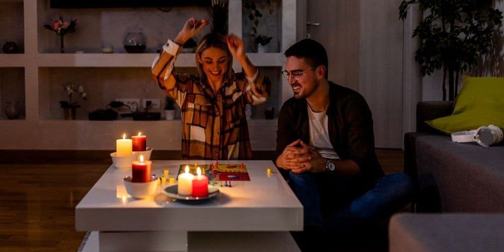 Couple playing a board game.