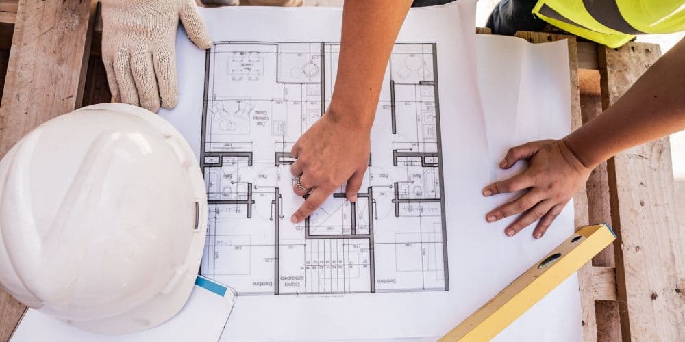 General contractors reviewing blueprints.