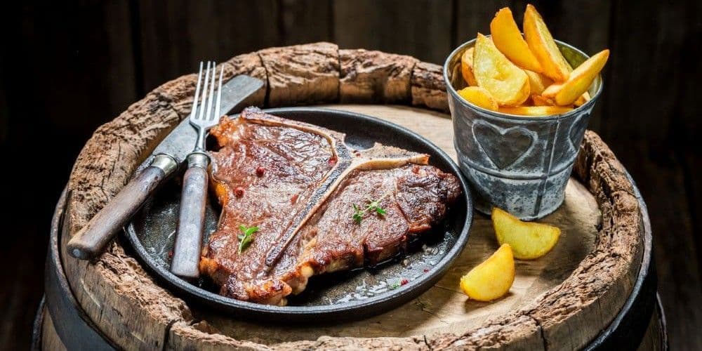 Steak and potatoes dinner at a restaurant with a country western ambience.