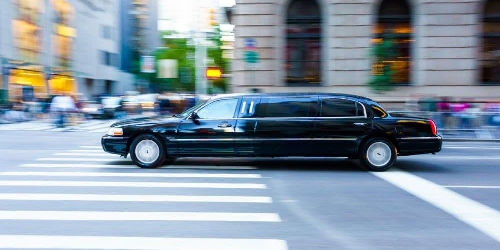 Limousine driving on the city streets.
